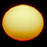 Sunspots on the surface of the sun that is distorted due to refraction