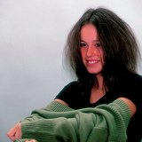 The sweater's electric charge is the opposite of our hair's when dressing