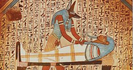 Anubis, bóg o głowie szakala mumifikuje zmarłego