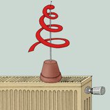 Wąż papierowy umieszczony na gorącym kaloryferze