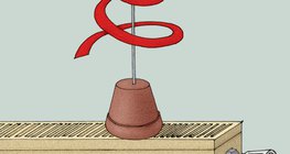 Wąż papierowy umieszczony na gorącym kaloryferze