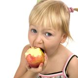 A girl eating an apple